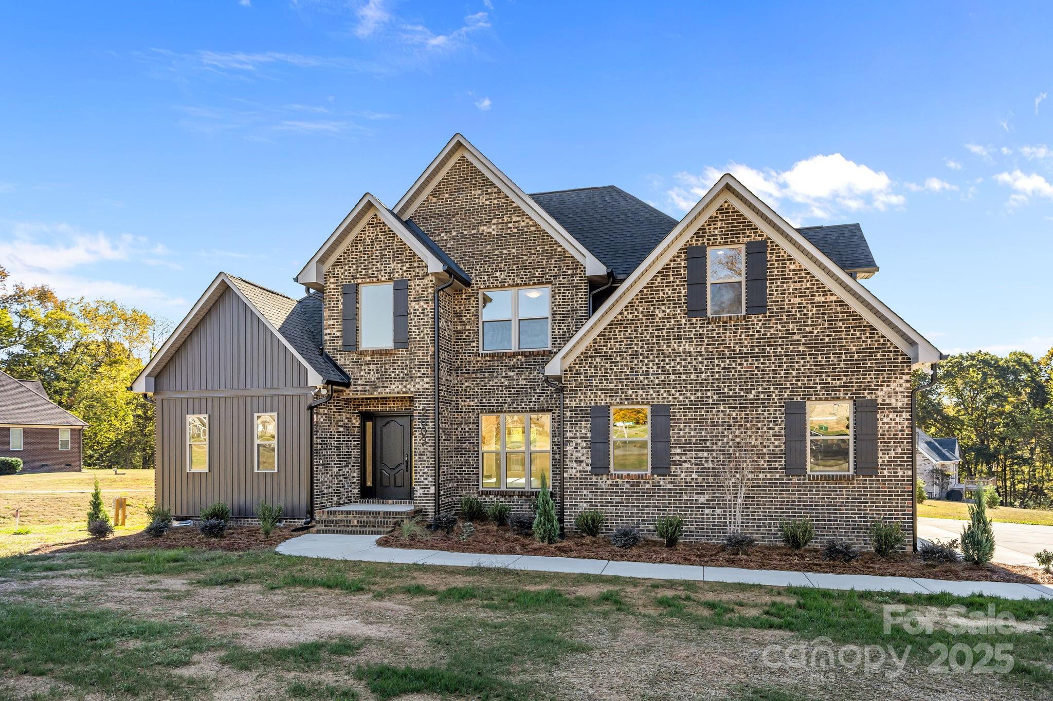 2003 Duntov Drive Monroe, NC 28110 - Photo 2 of 44 front view of a house with a yard