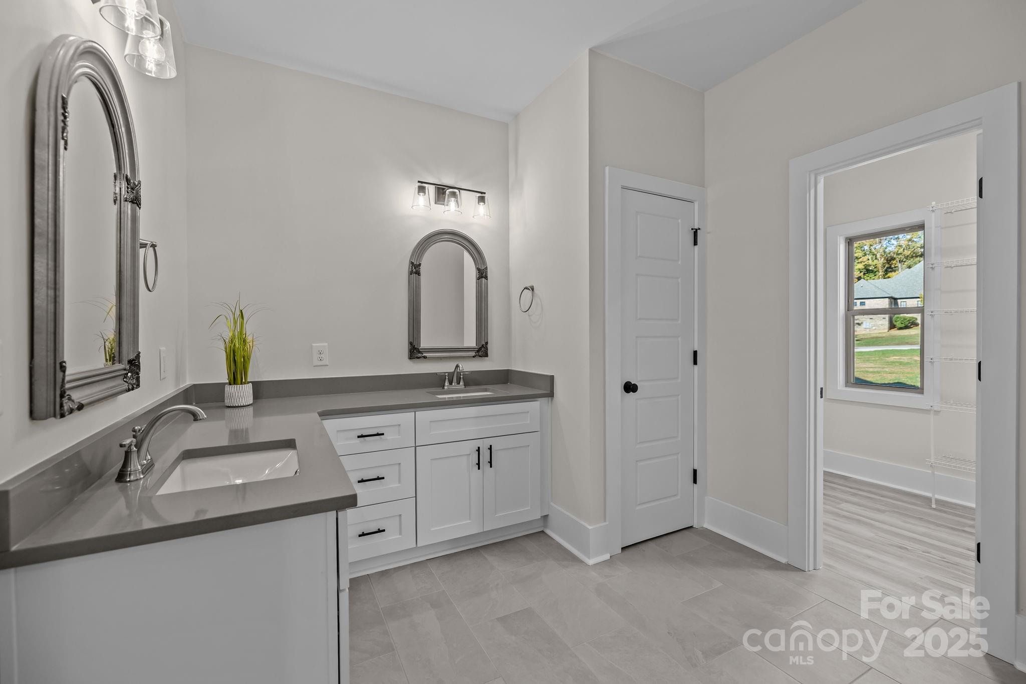 2003 Duntov Drive Monroe, NC 28110 - Photo 23 of 44 a bathroom with a double vanity sink and a mirror
