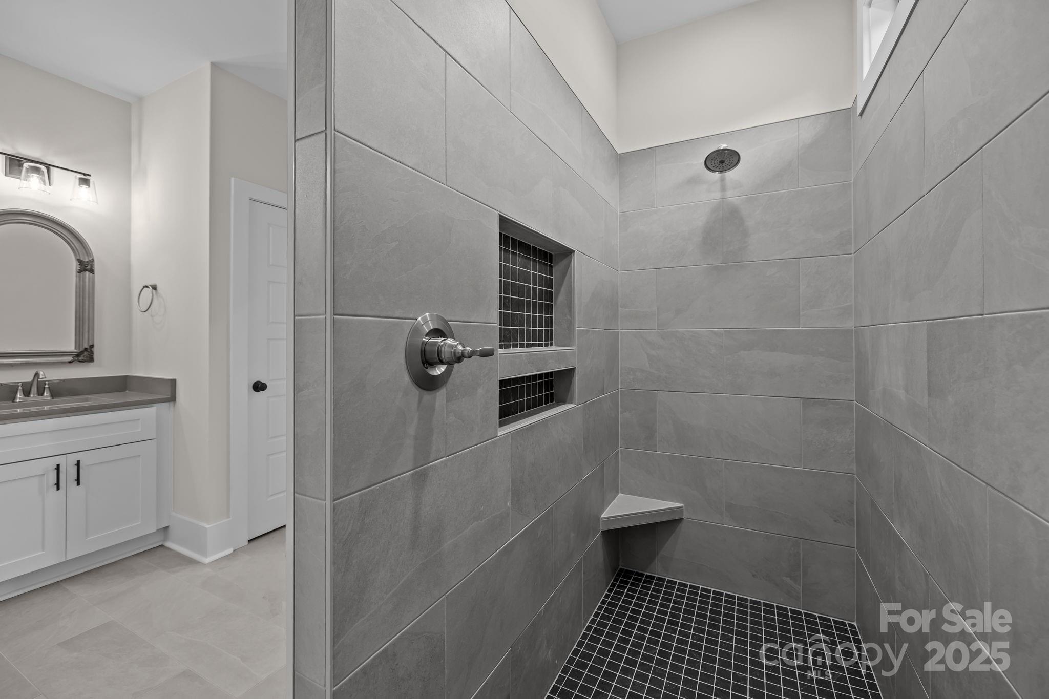2003 Duntov Drive Monroe, NC 28110 - Photo 24 of 44 a bathroom with a sink a toilet a shower and a mirror