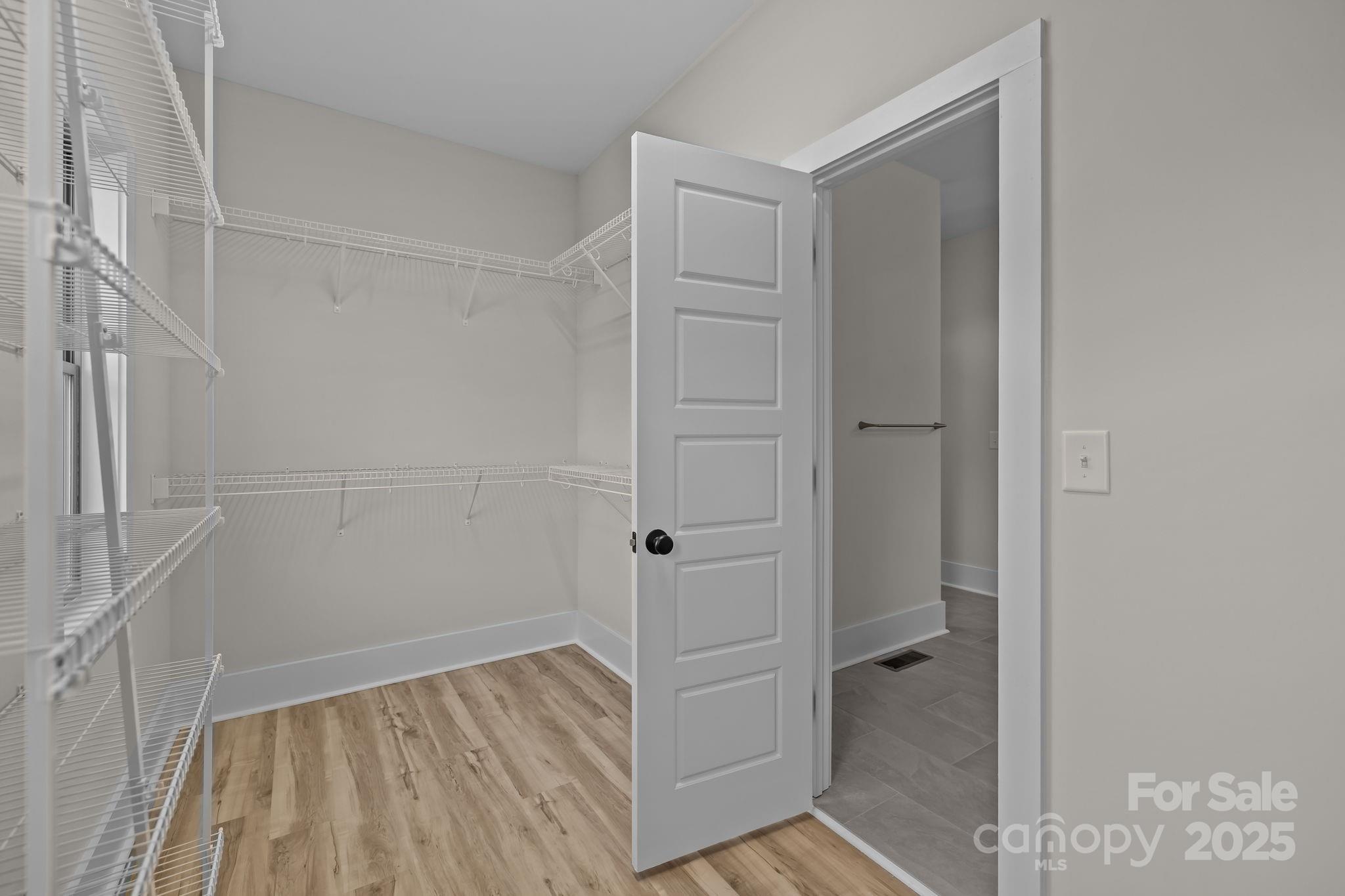 2003 Duntov Drive Monroe, NC 28110 - Photo 25 of 44 a view of a hallway with wooden floor and staircase