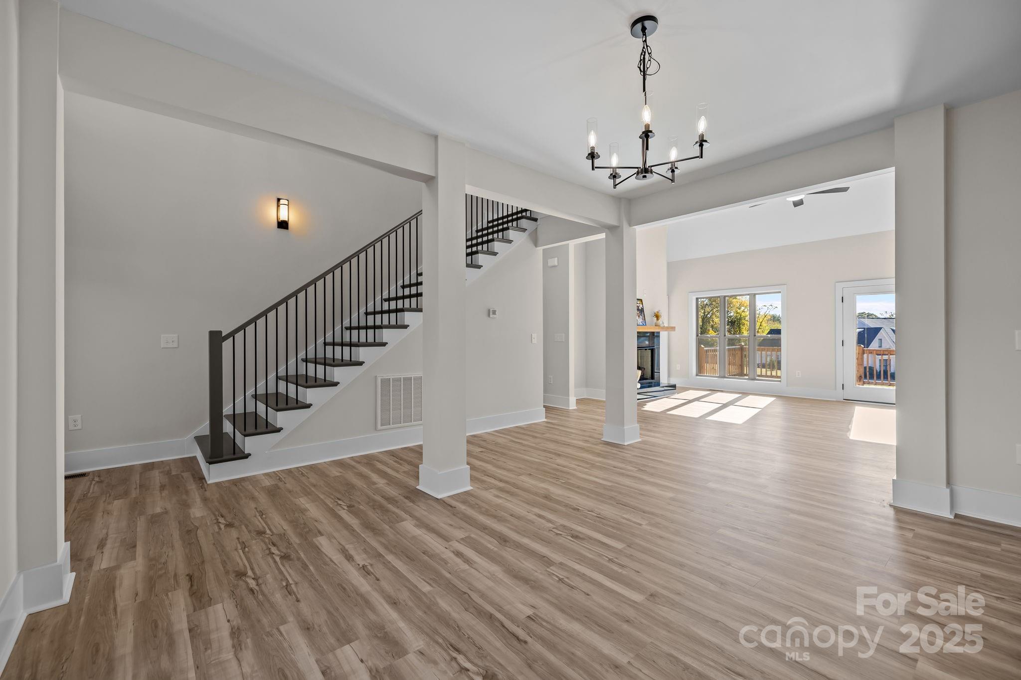 2003 Duntov Drive Monroe, NC 28110 - Photo 6 of 44 a view of a room with wooden floor chandelier and entryway
