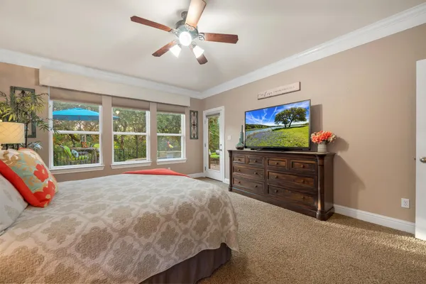 a bed room with a bed and a television
