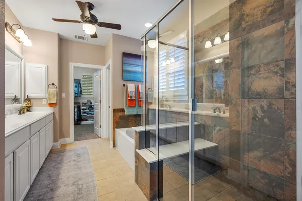a bathroom with a shower and a sink