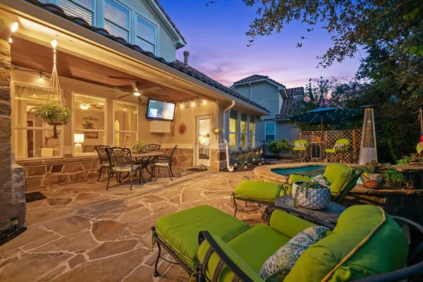a view of a patio with couches table and chairs