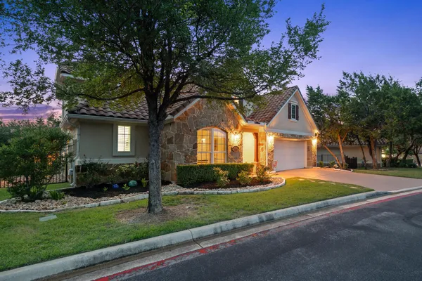 a front view of a house with a yard