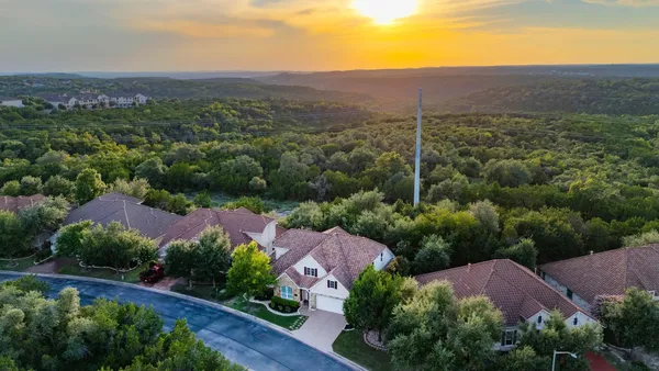 an aerial view of a house with a garden