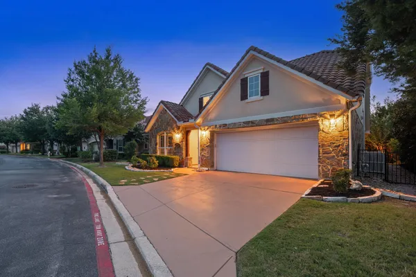 a front view of a house with yard