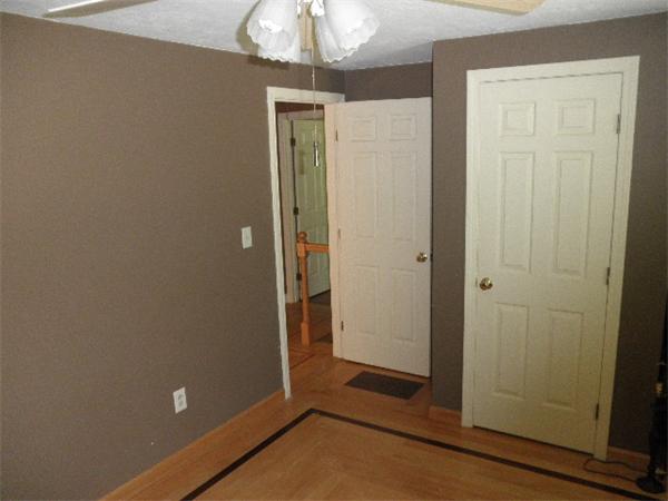310 Wallum Lake Road Douglas, MA 01516 - Photo 14 of 19 a view of a small space with wooden floor and a chandelier fan
