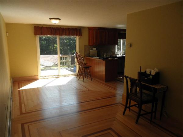 310 Wallum Lake Road Douglas, MA 01516 - Photo 5 of 19 a kitchen with a table chairs and a refrigerator