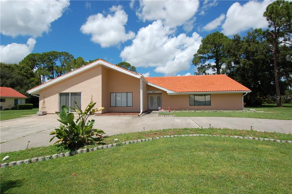 5009 Kingsley Road North Port, FL 34287 - Photo 1 of 1 a view of a house with a backyard
