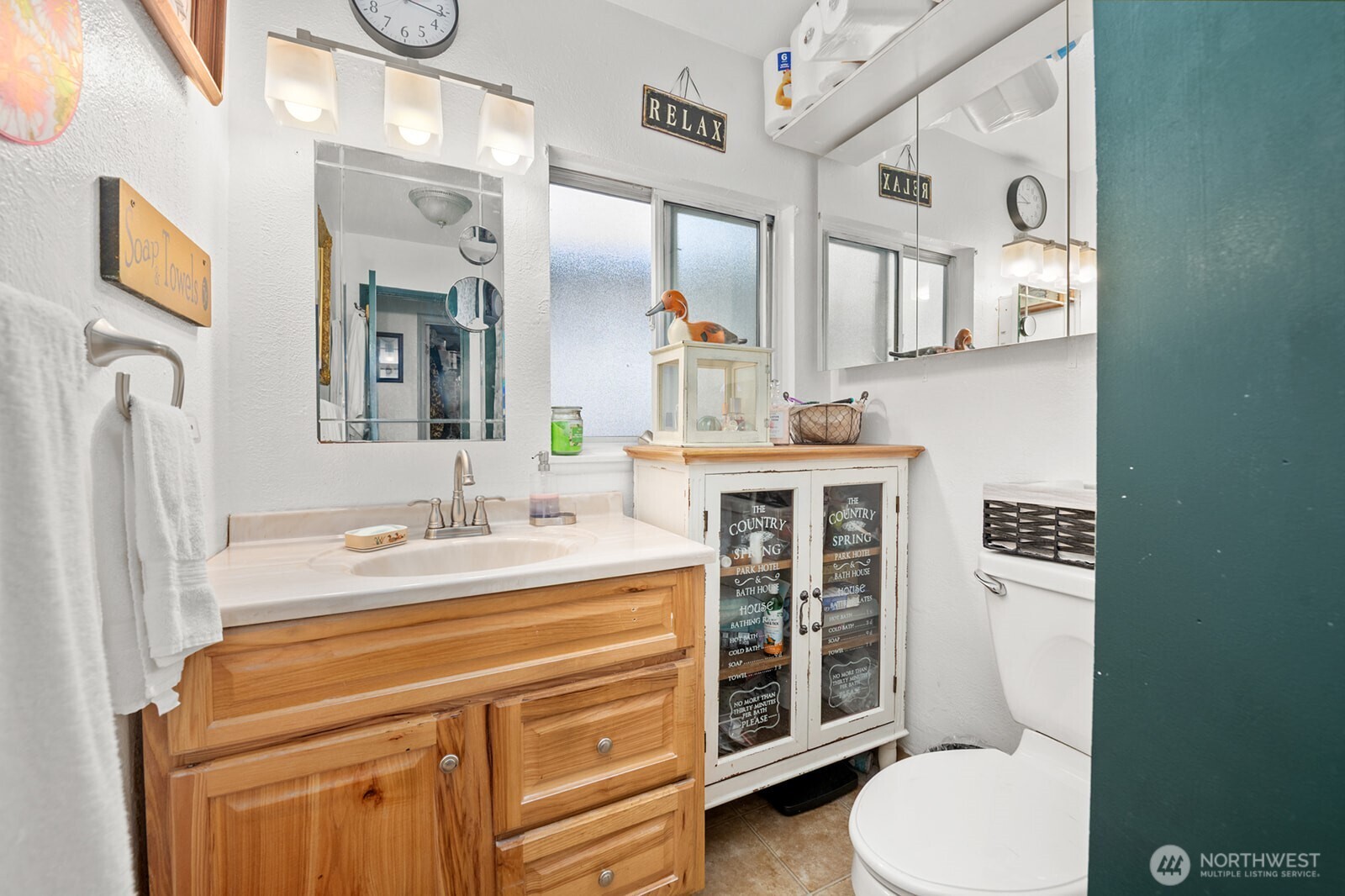 700 Harding Road Aberdeen, WA 98520 - Photo 8 of 21 a bathroom with a sink a toilet and mirror