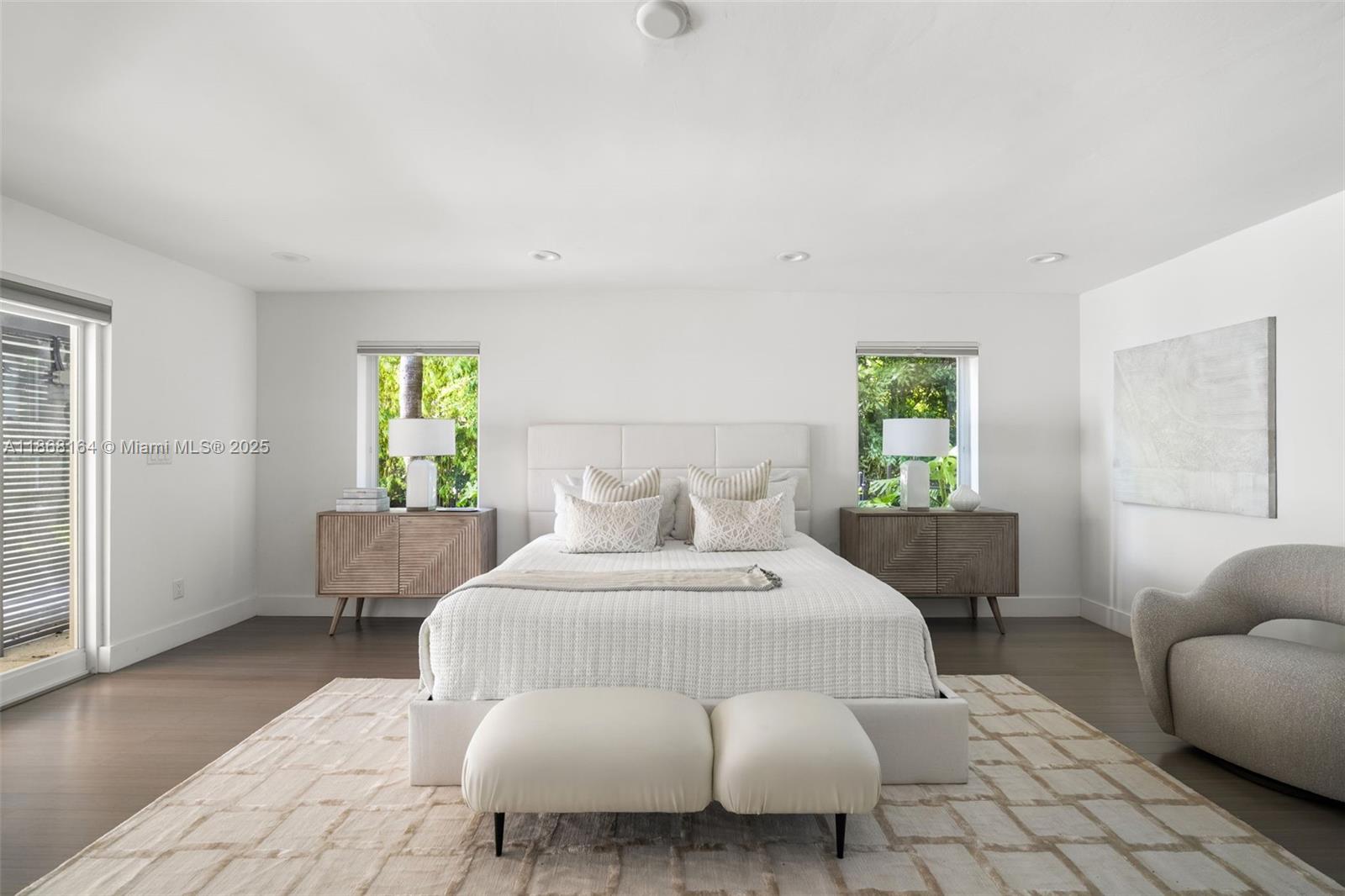 11001 Southwest 64th Avenue Pinecrest, FL 33156 - Photo 17 of 37 a bedroom with a bed and a couch