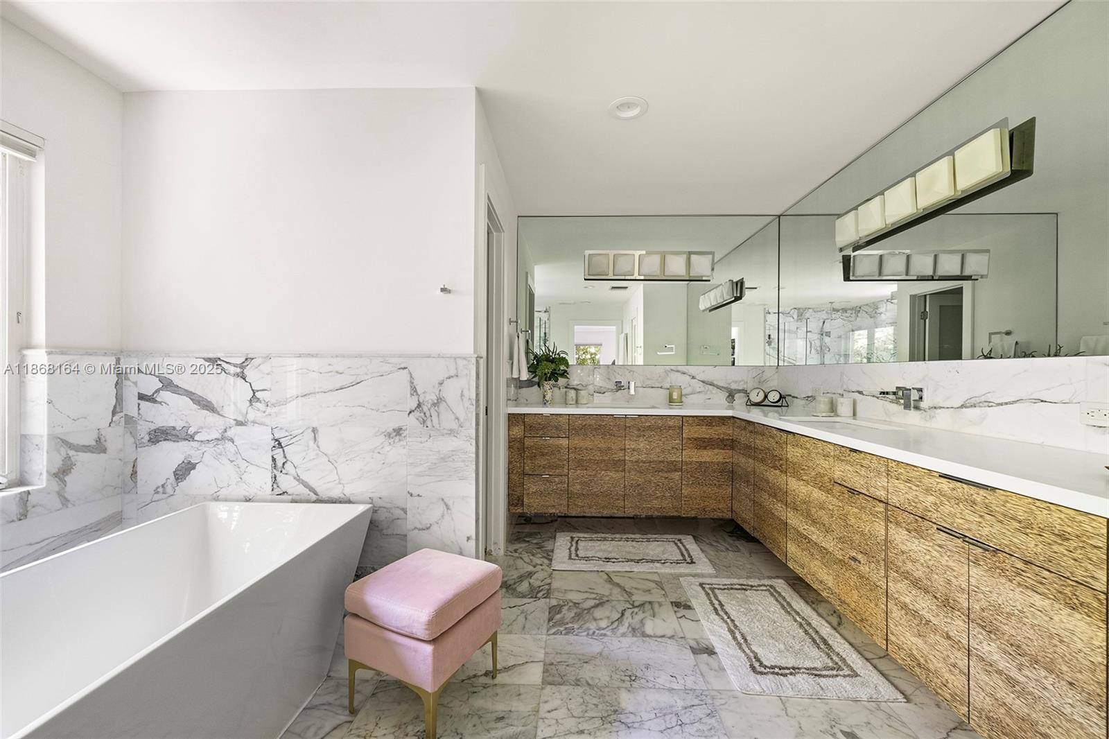 11001 Southwest 64th Avenue Pinecrest, FL 33156 - Photo 19 of 37 a bathroom with a bathtub sink and toilet