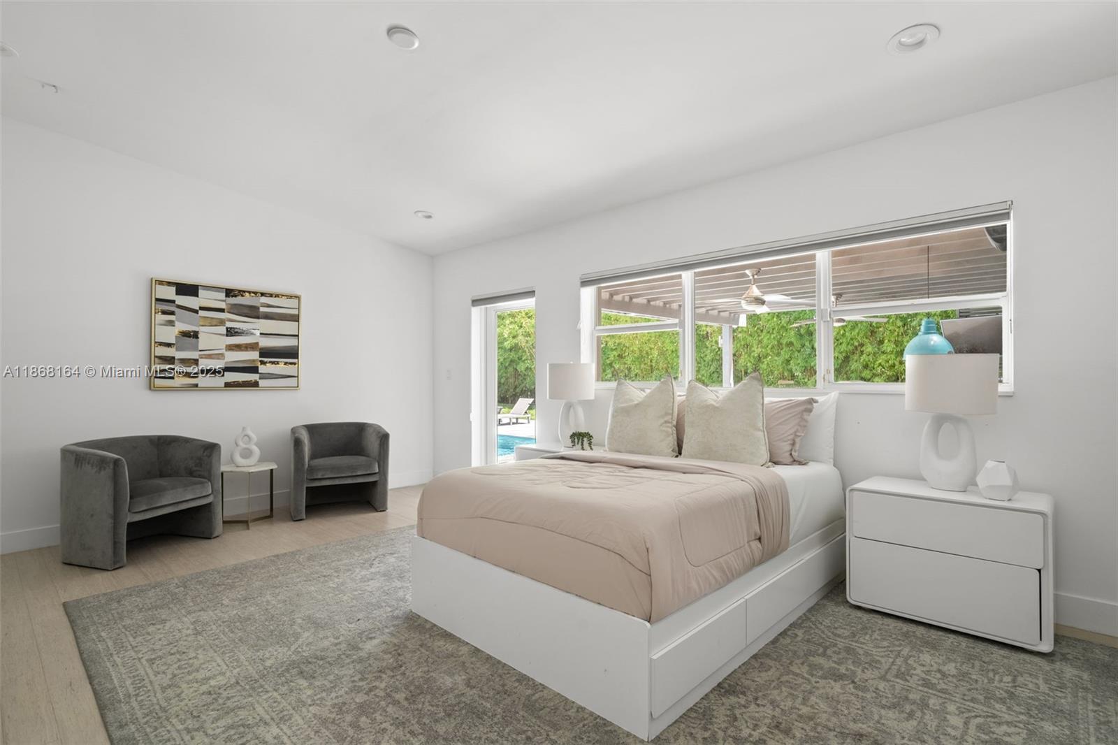 11001 Southwest 64th Avenue Pinecrest, FL 33156 - Photo 22 of 37 a bedroom with a bed and a couch