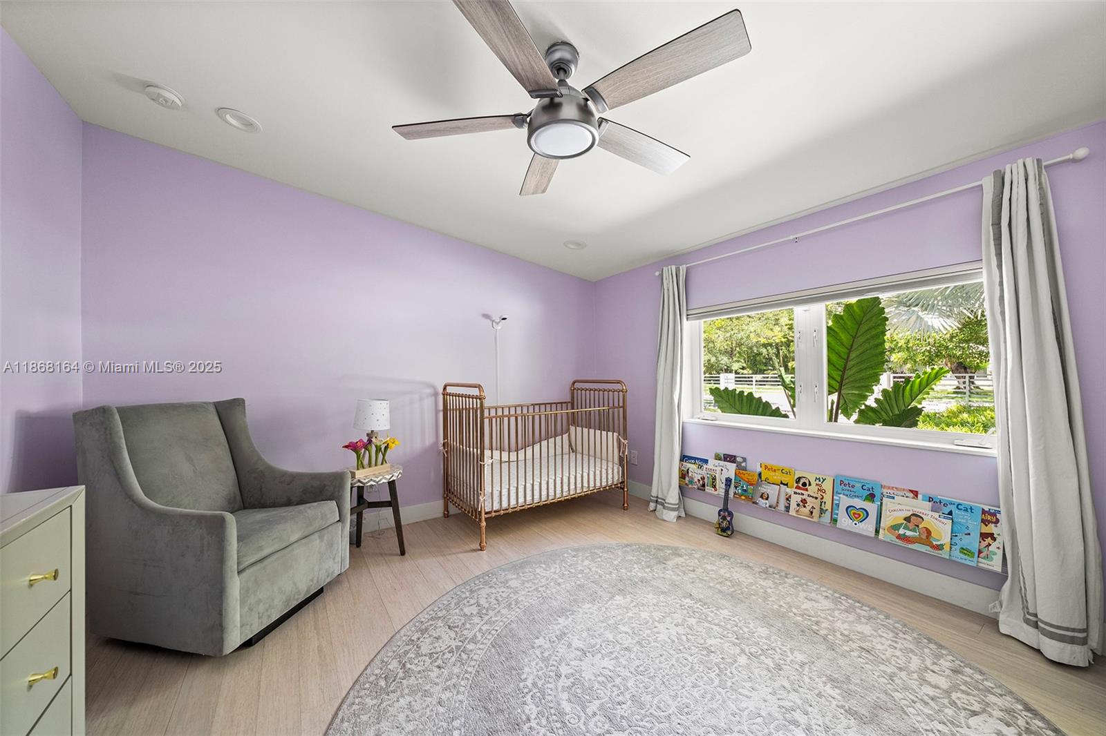 11001 Southwest 64th Avenue Pinecrest, FL 33156 - Photo 25 of 37 a living room with furniture and a large window