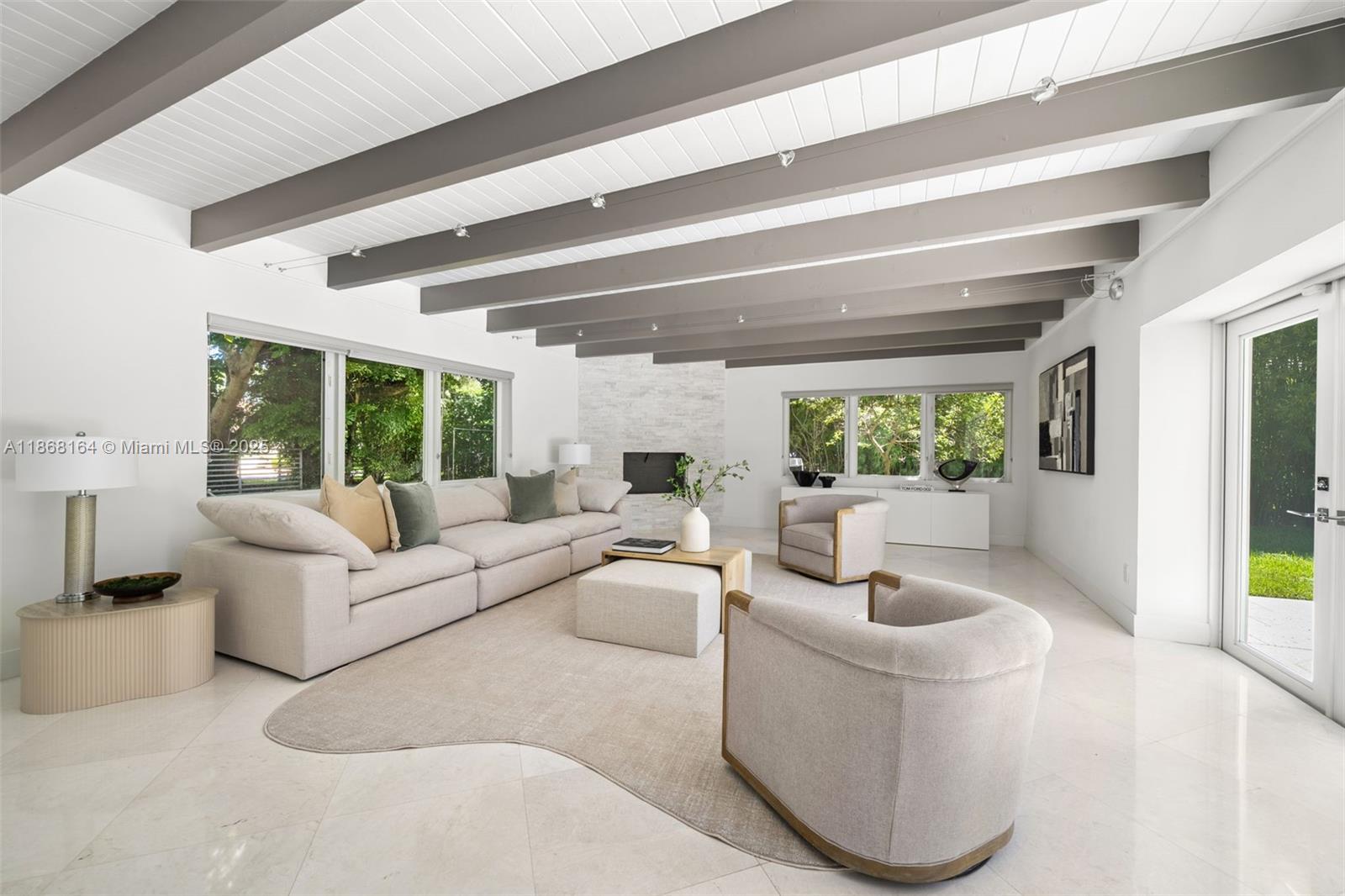 11001 Southwest 64th Avenue Pinecrest, FL 33156 - Photo 3 of 37 a living room with furniture and a large window