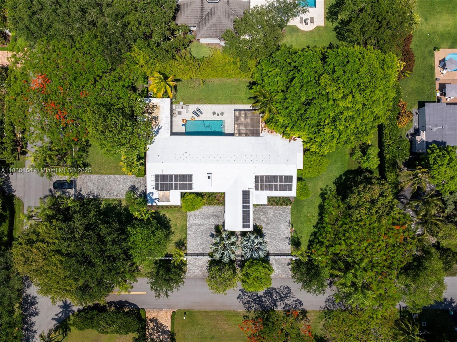 11001 Southwest 64th Avenue Pinecrest, FL 33156 - Photo 34 of 37 an aerial view of a house