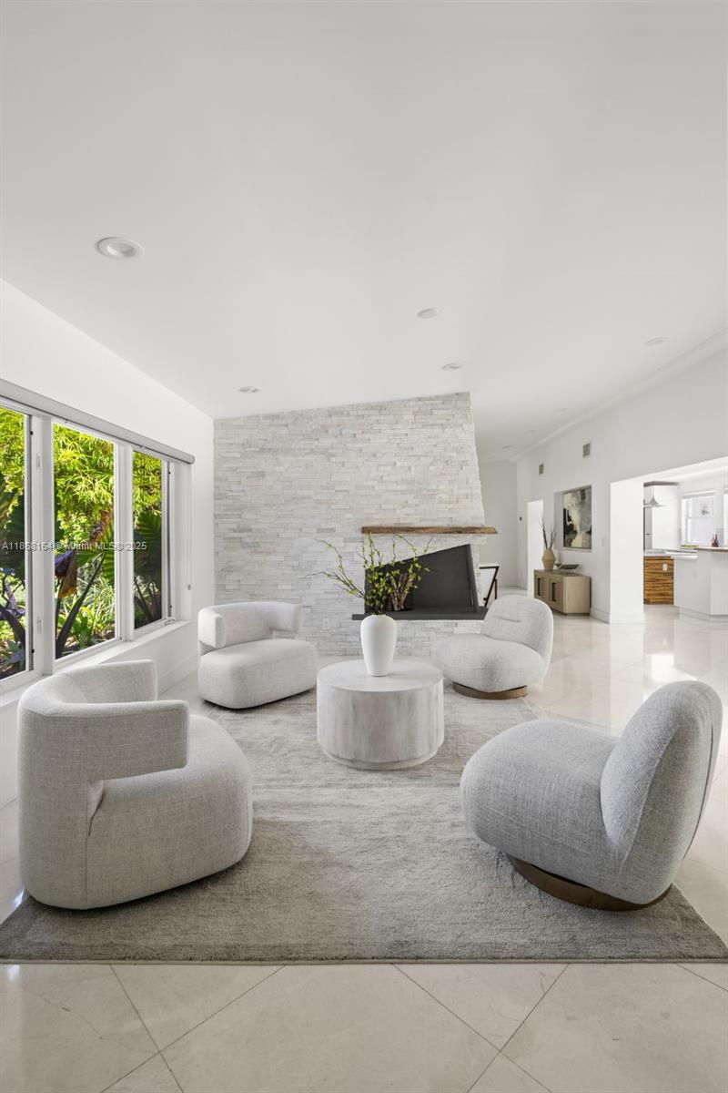 11001 Southwest 64th Avenue Pinecrest, FL 33156 - Photo 4 of 37 a living room with furniture and a large window