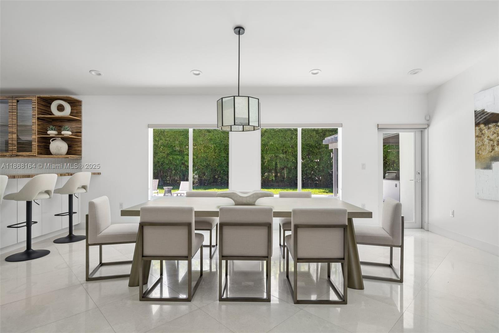11001 Southwest 64th Avenue Pinecrest, FL 33156 - Photo 8 of 37 a view of a dining room with furniture window and outside view