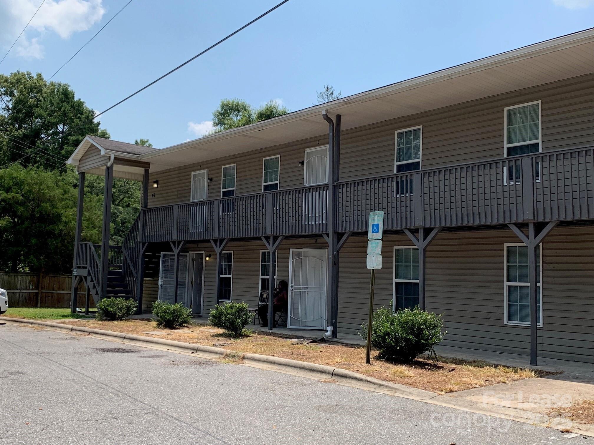 56 Tribune Avenue Southwest, Unit C Concord, NC 28025 - Photo 1 of 11 a front view of a house with garden