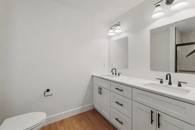 a bathroom with a glass shower door