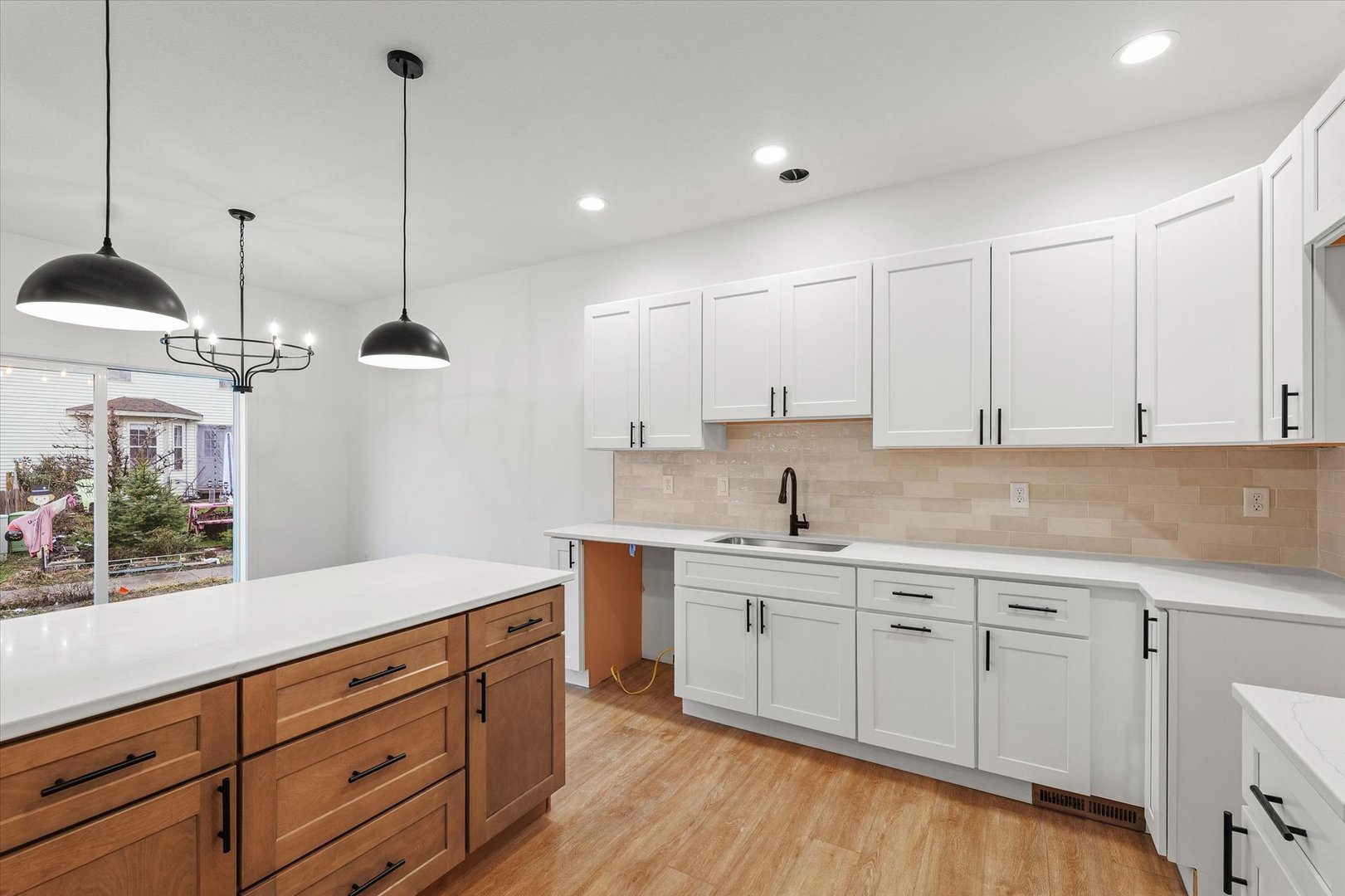 3712 Lighthouse Pointe Champaign, IL 61822 - Photo 10 of 36 a kitchen with a sink window and cabinets