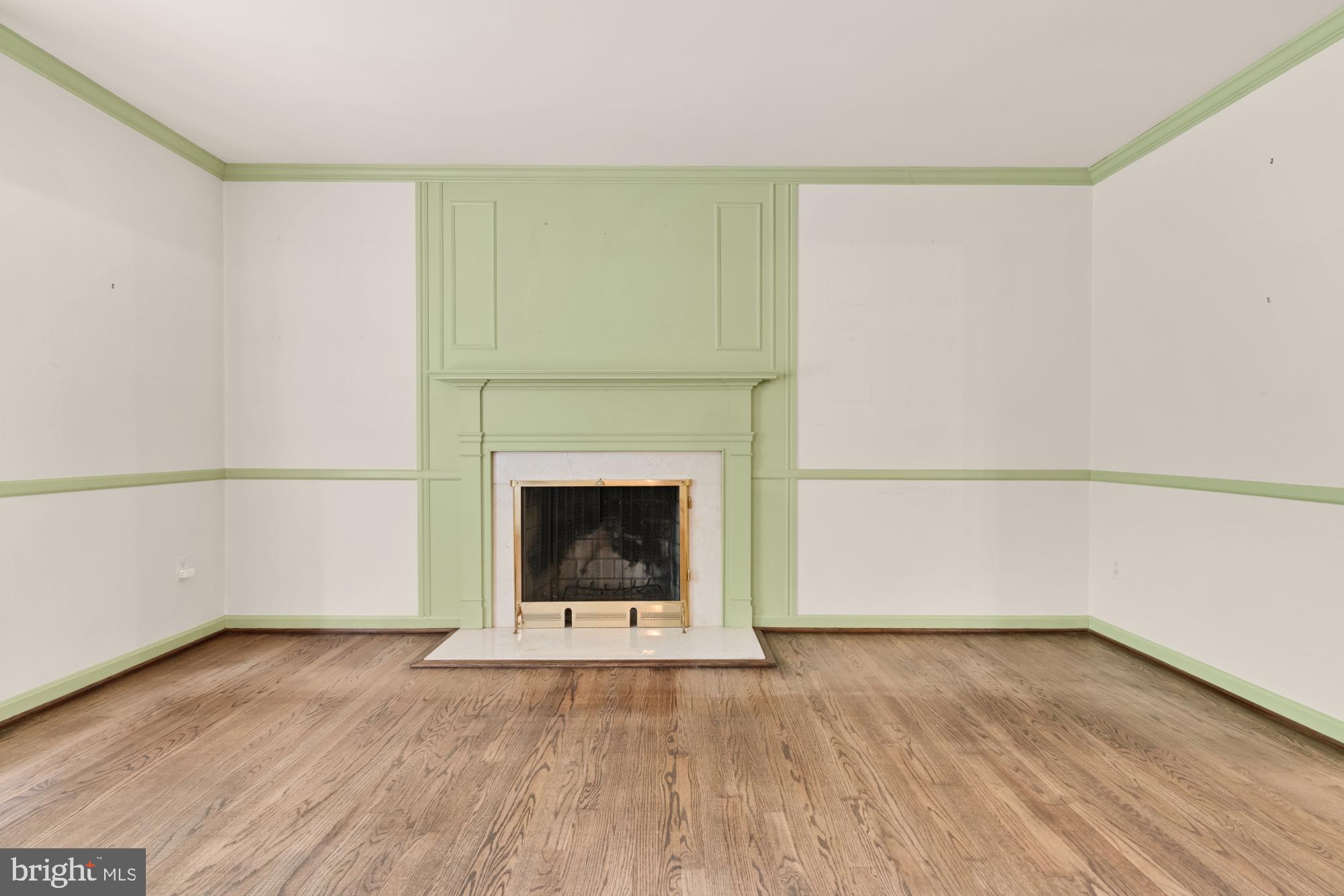 13001 Dulaney Valley Road Glen Arm, MD 21057 - Photo 11 of 52 a room with a fireplace and a wooden floor