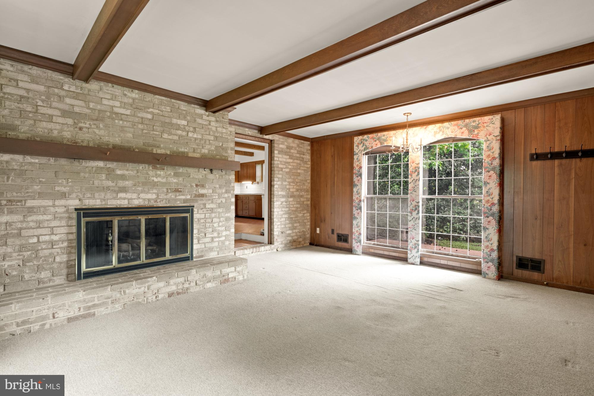 13001 Dulaney Valley Road Glen Arm, MD 21057 - Photo 15 of 52 a view of an empty room with a fireplace and a window