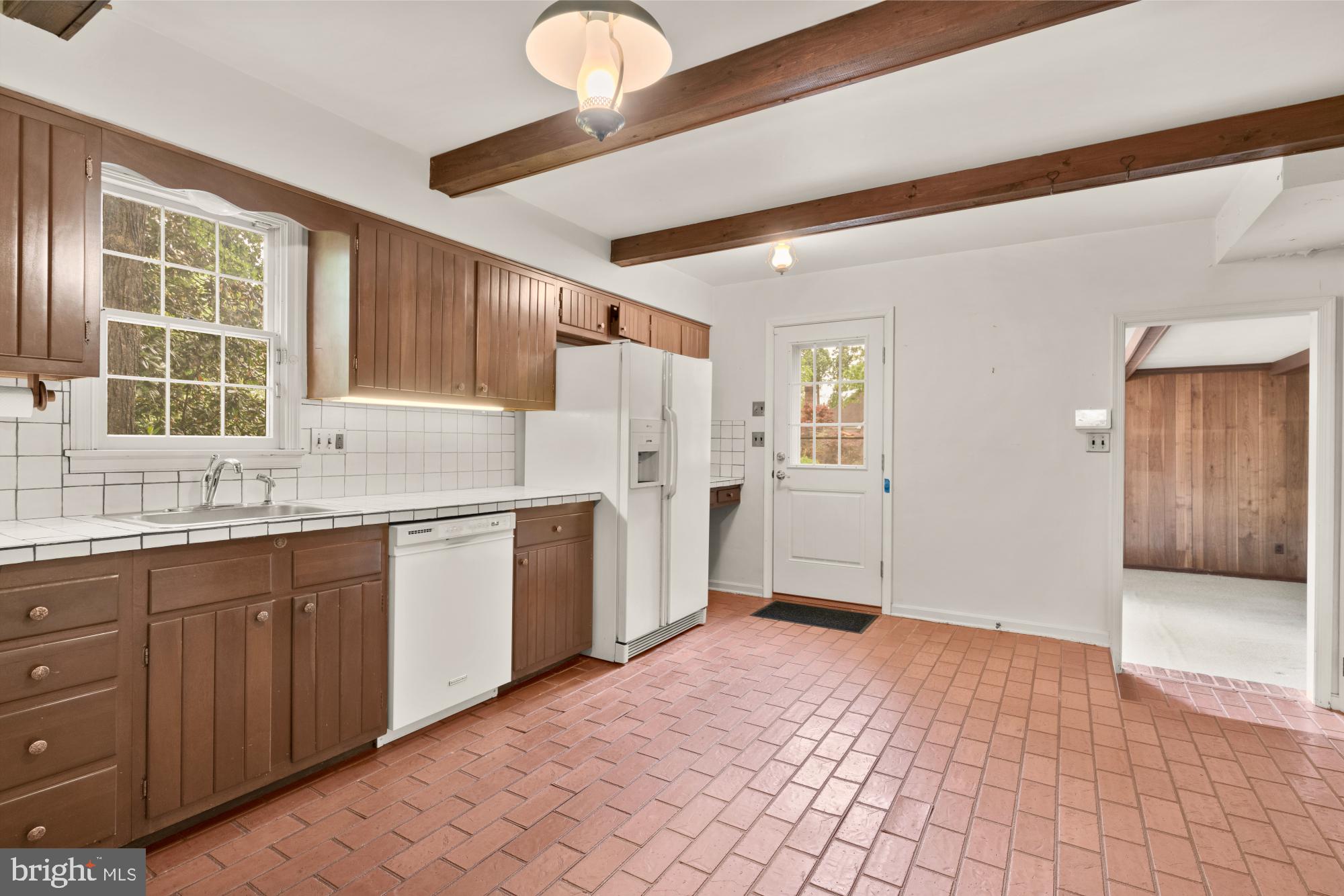 13001 Dulaney Valley Road Glen Arm, MD 21057 - Photo 22 of 52 a kitchen with granite countertop a sink cabinets and window