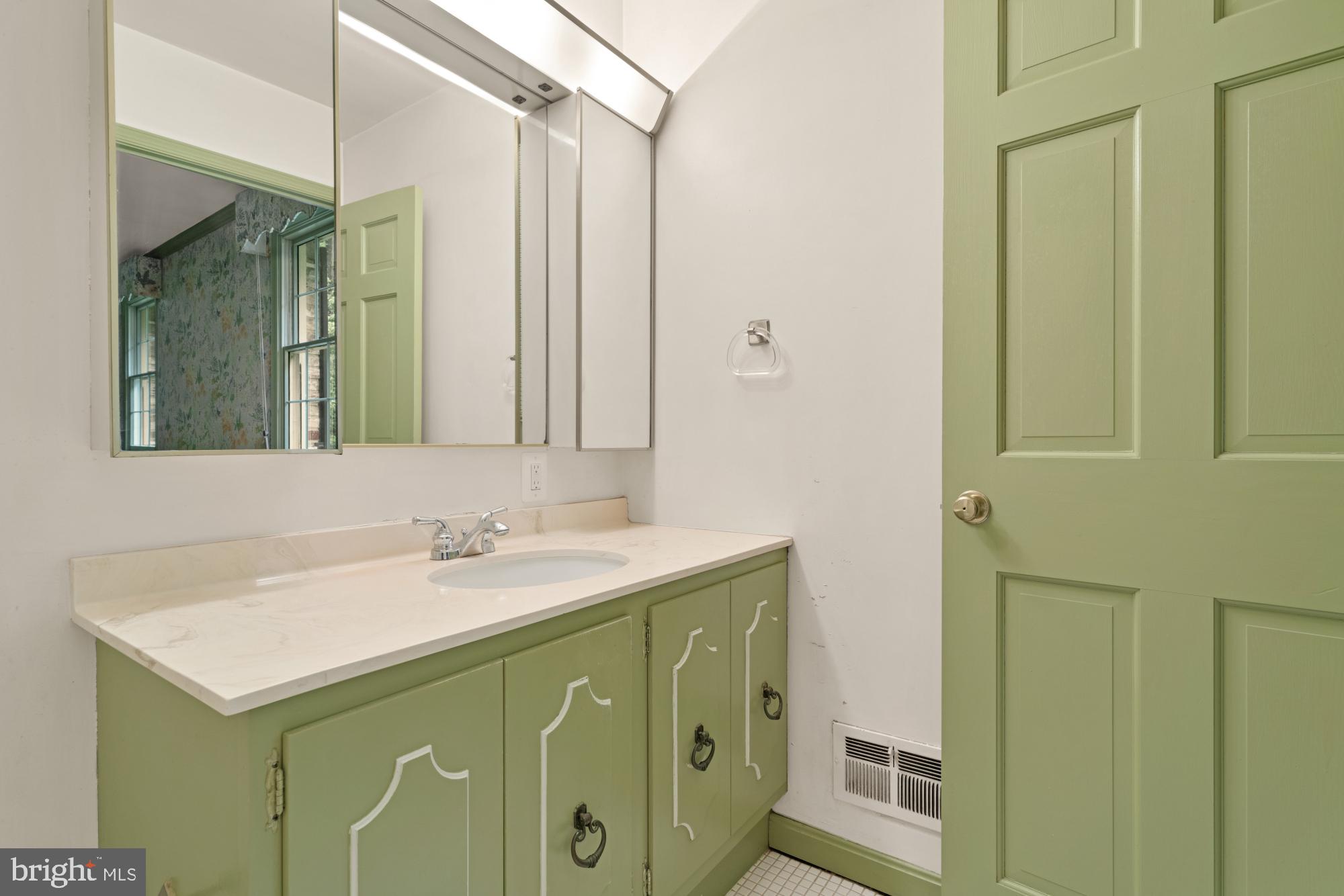 13001 Dulaney Valley Road Glen Arm, MD 21057 - Photo 29 of 52 a bathroom with a sink and a mirror