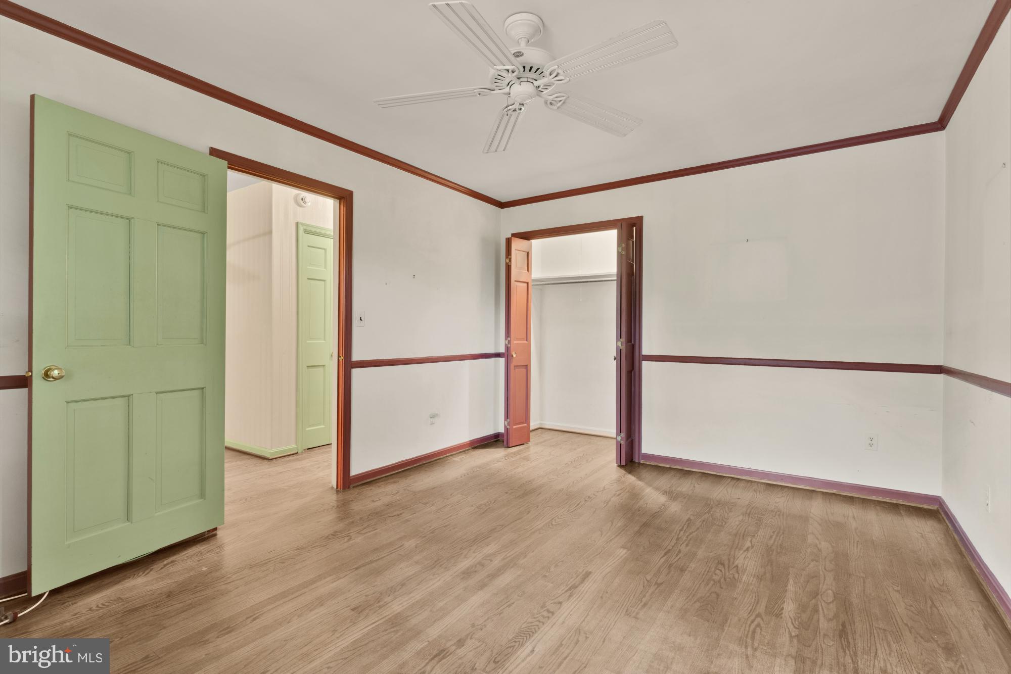 13001 Dulaney Valley Road Glen Arm, MD 21057 - Photo 35 of 52 an empty room with wooden floor and a ceiling fan