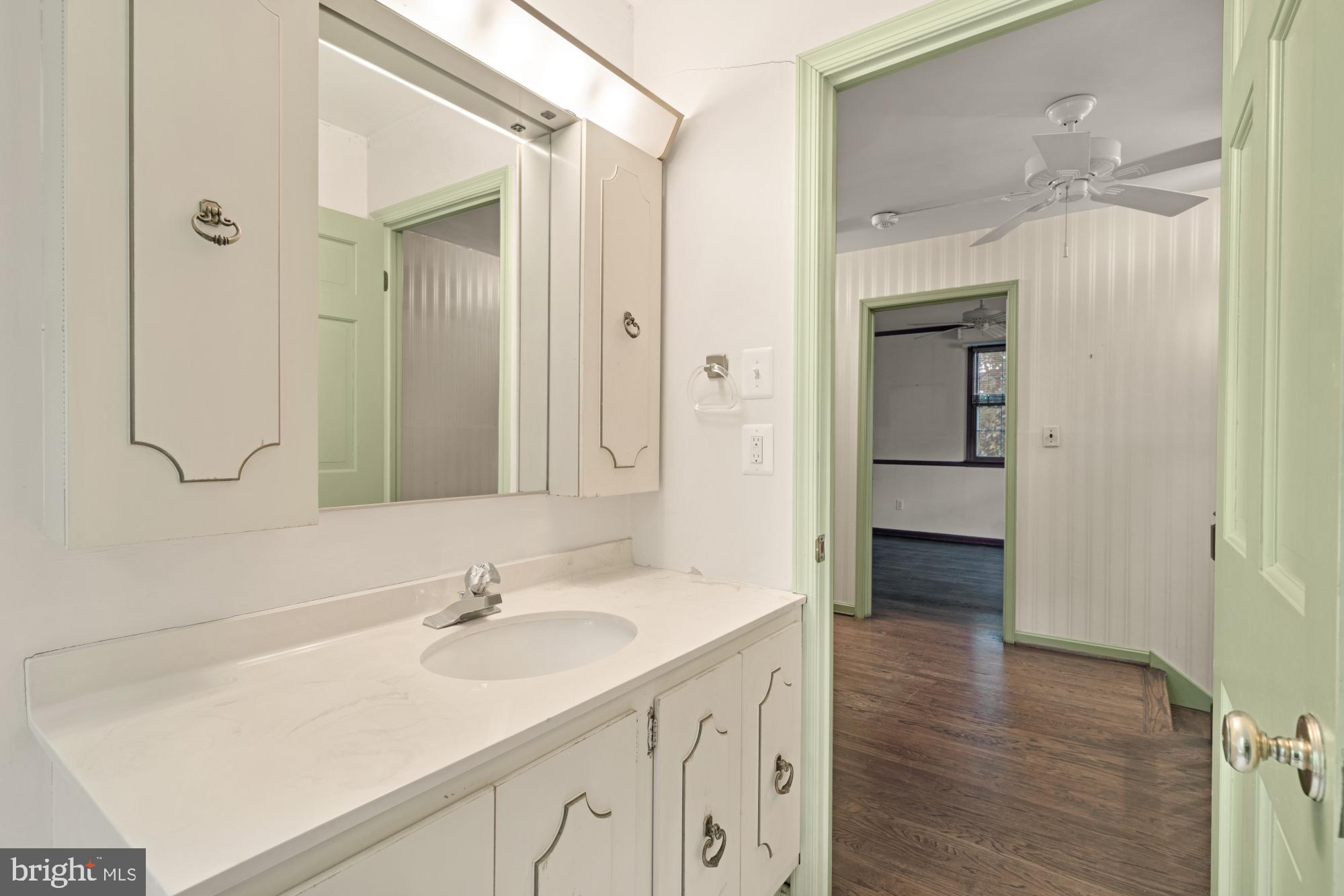 13001 Dulaney Valley Road Glen Arm, MD 21057 - Photo 37 of 52 a bathroom with a sink and a mirror