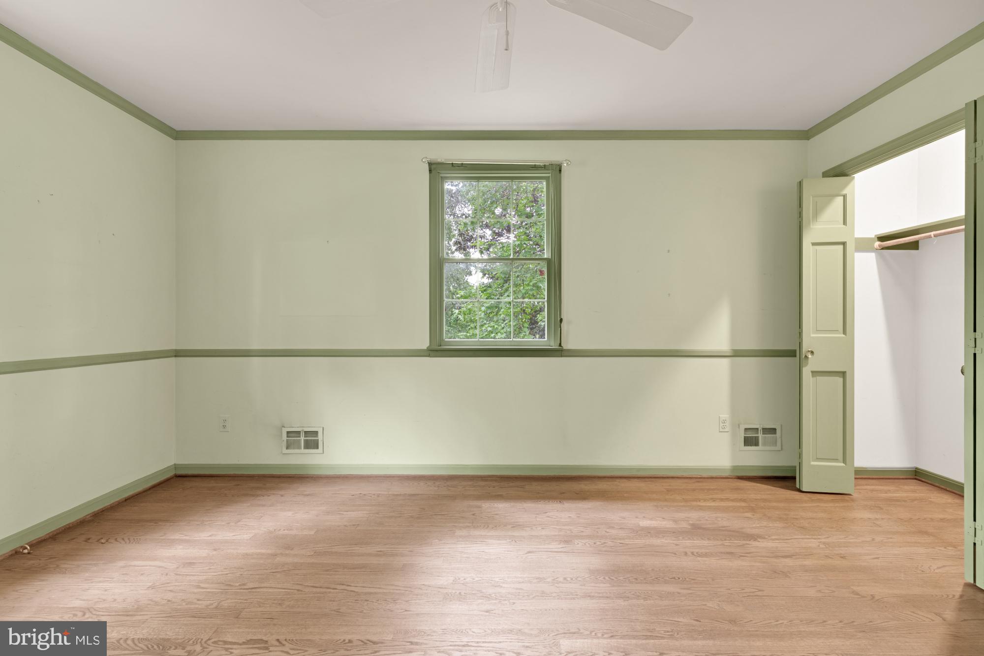 13001 Dulaney Valley Road Glen Arm, MD 21057 - Photo 39 of 52 an empty room with wooden floor and windows