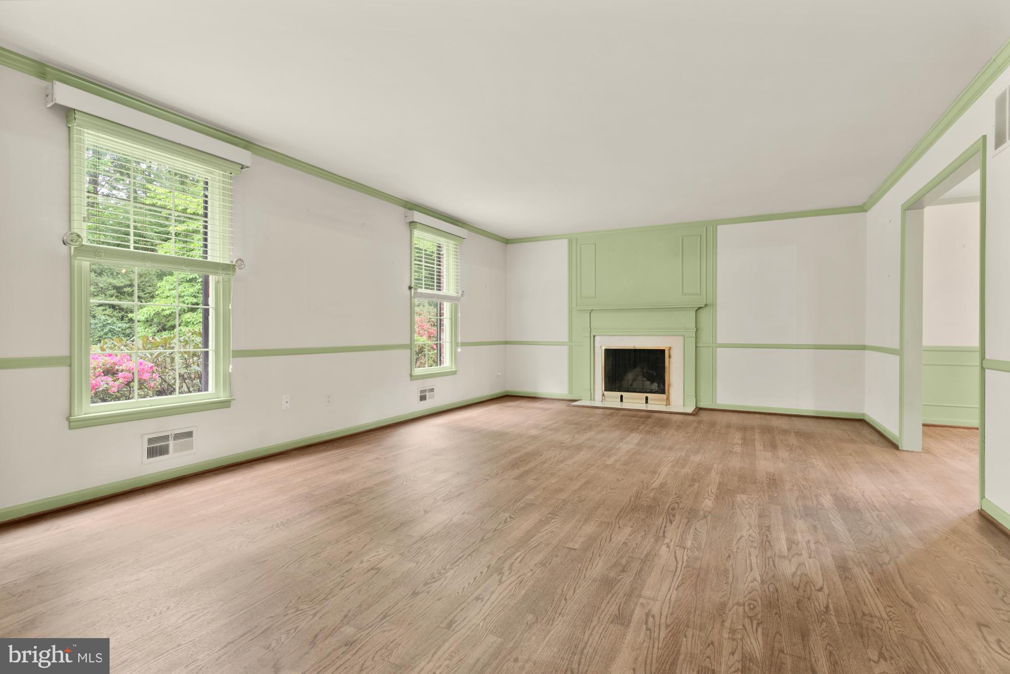13001 Dulaney Valley Road Glen Arm, MD 21057 - Photo 7 of 52 an empty room with windows and fireplace