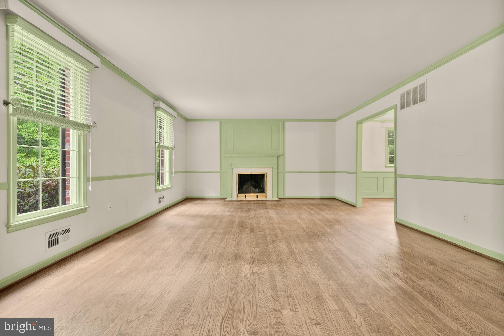 13001 Dulaney Valley Road Glen Arm, MD 21057 - Photo 8 of 52 a view of empty room with wooden floor and fireplace