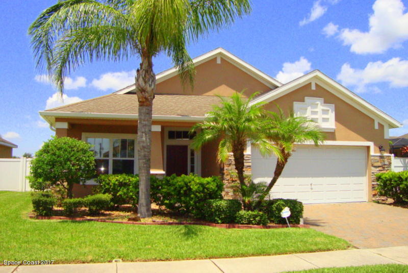1441 Bridgeport Circle Rockledge, FL 32955 - Photo 1 of 26 a front view of a house with a garden