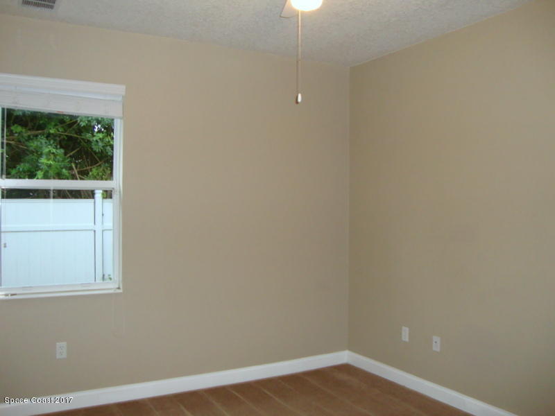 1441 Bridgeport Circle Rockledge, FL 32955 - Photo 17 of 26 a view of an empty room with a window
