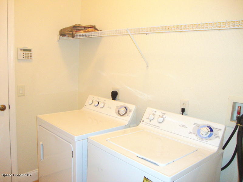 1441 Bridgeport Circle Rockledge, FL 32955 - Photo 20 of 26 a utility room with dryer and washer