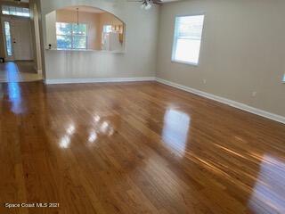 1441 Bridgeport Circle Rockledge, FL 32955 - Photo 4 of 26 a view of empty room with wooden floor