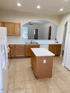 1441 Bridgeport Circle Rockledge, FL 32955 - Photo 6 of 26 a large kitchen with kitchen island a sink a counter top and stove