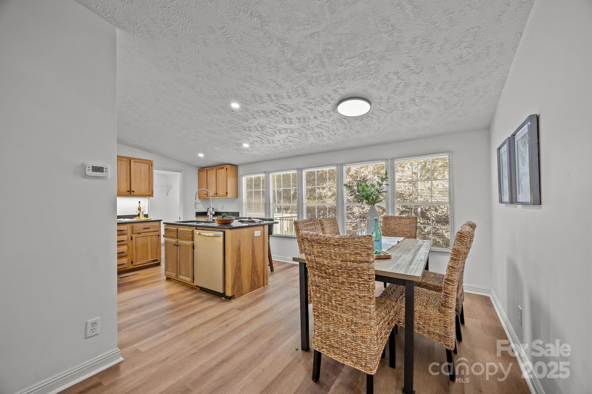 86 Tuts Terrace Sylva, NC 28779 - Photo 11 of 48 a dining room with furniture and wooden floor
