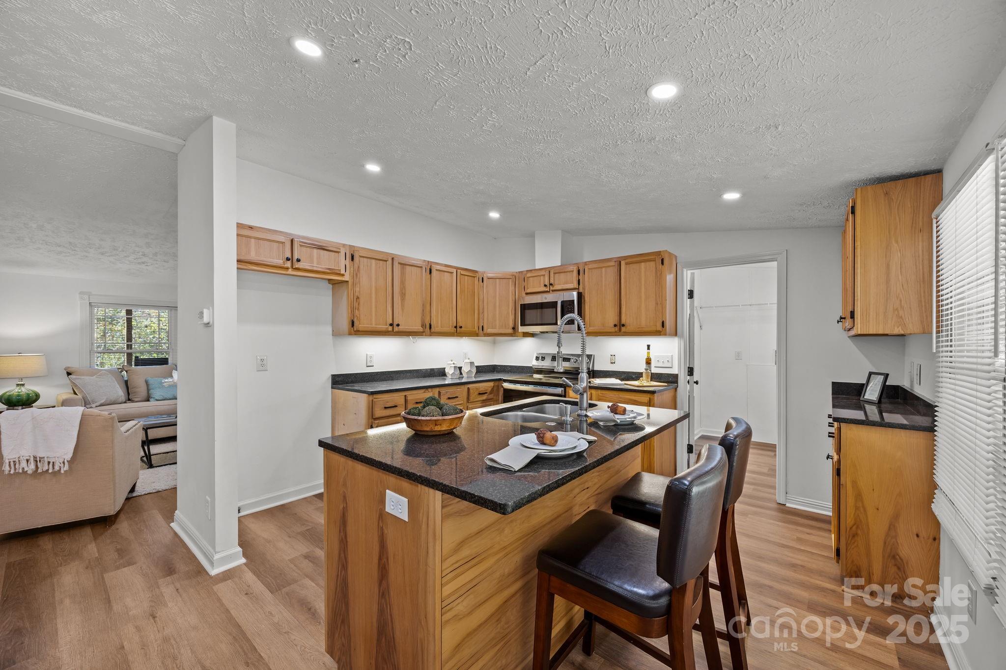 86 Tuts Terrace Sylva, NC 28779 - Photo 14 of 48 a kitchen with a stove a refrigerator and a dining table