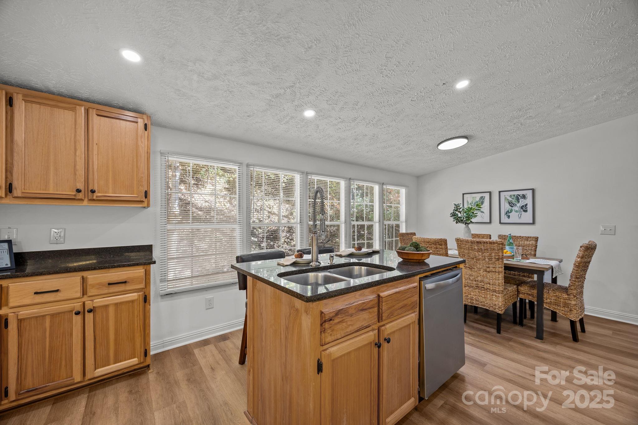 86 Tuts Terrace Sylva, NC 28779 - Photo 17 of 48 a kitchen with granite countertop a sink stove and cabinets