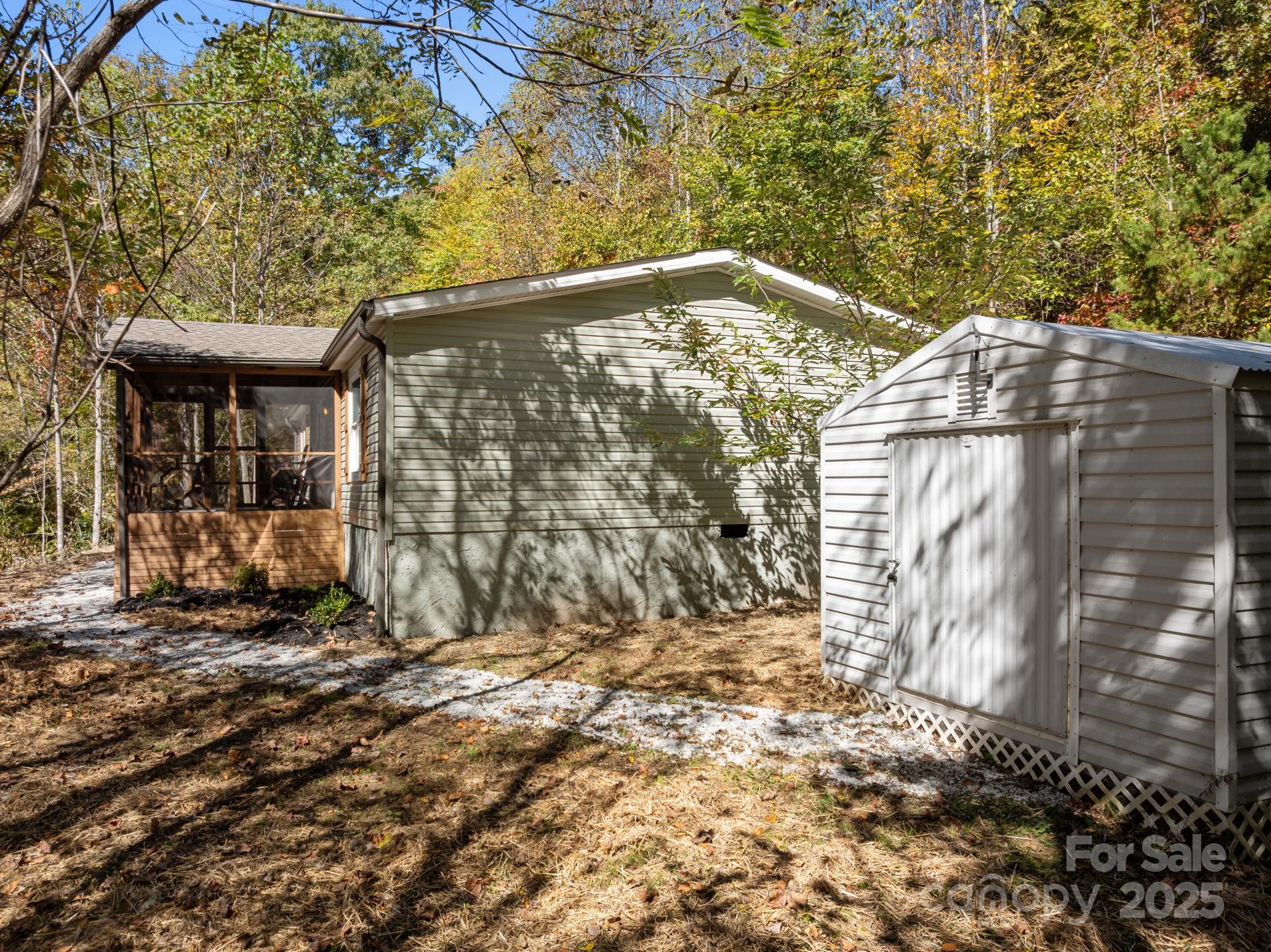 86 Tuts Terrace Sylva, NC 28779 - Photo 31 of 48 a side view of a house with a yard