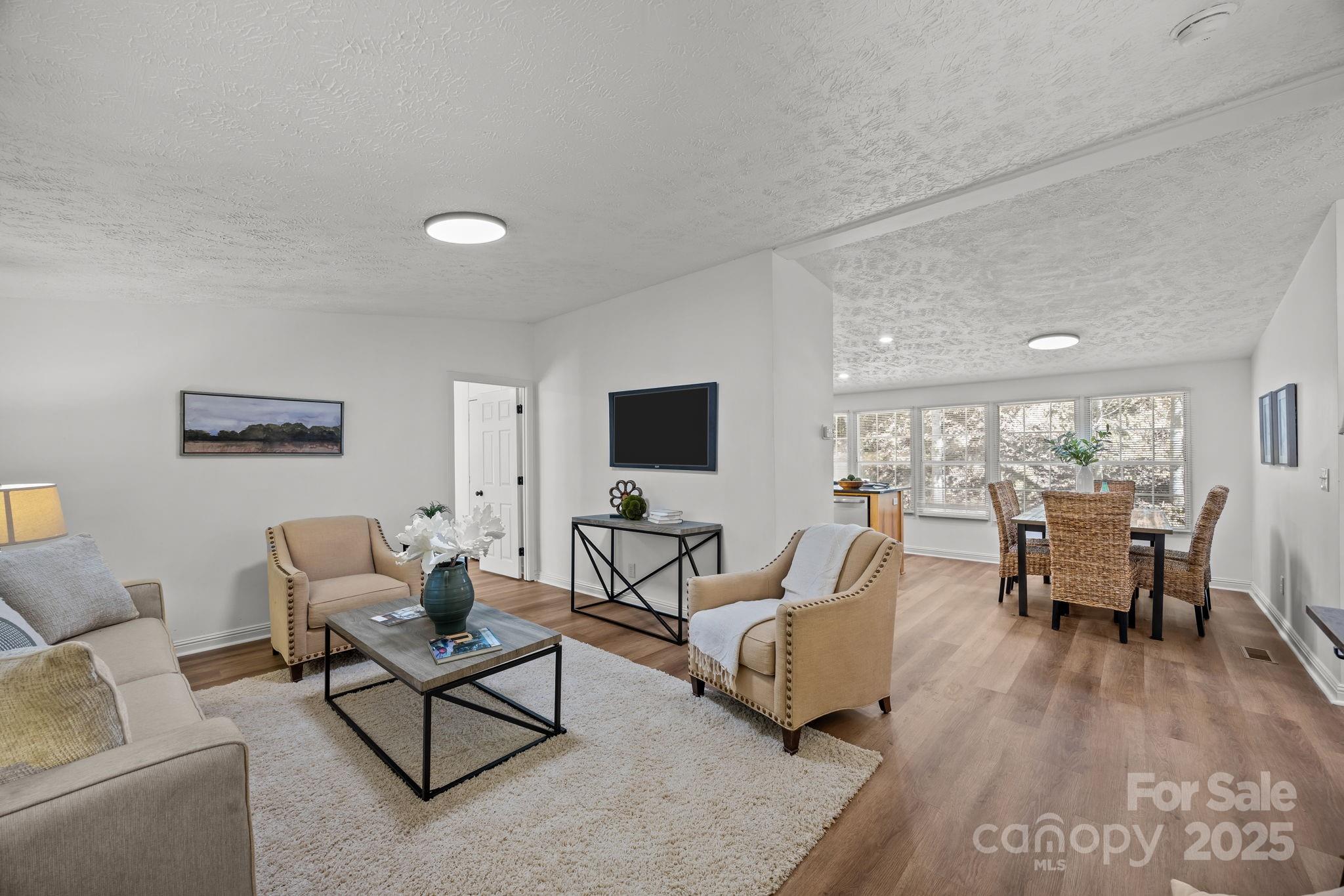 86 Tuts Terrace Sylva, NC 28779 - Photo 4 of 48 a living room with furniture and a flat screen tv