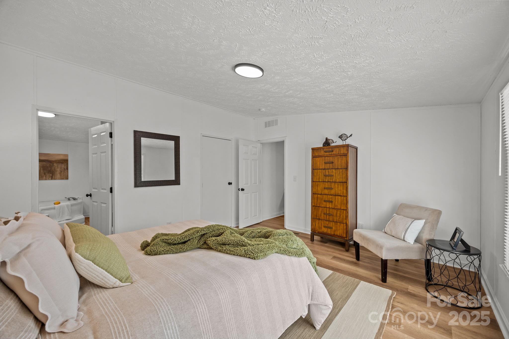 86 Tuts Terrace Sylva, NC 28779 - Photo 5 of 48 a bedroom with a bed and a couch