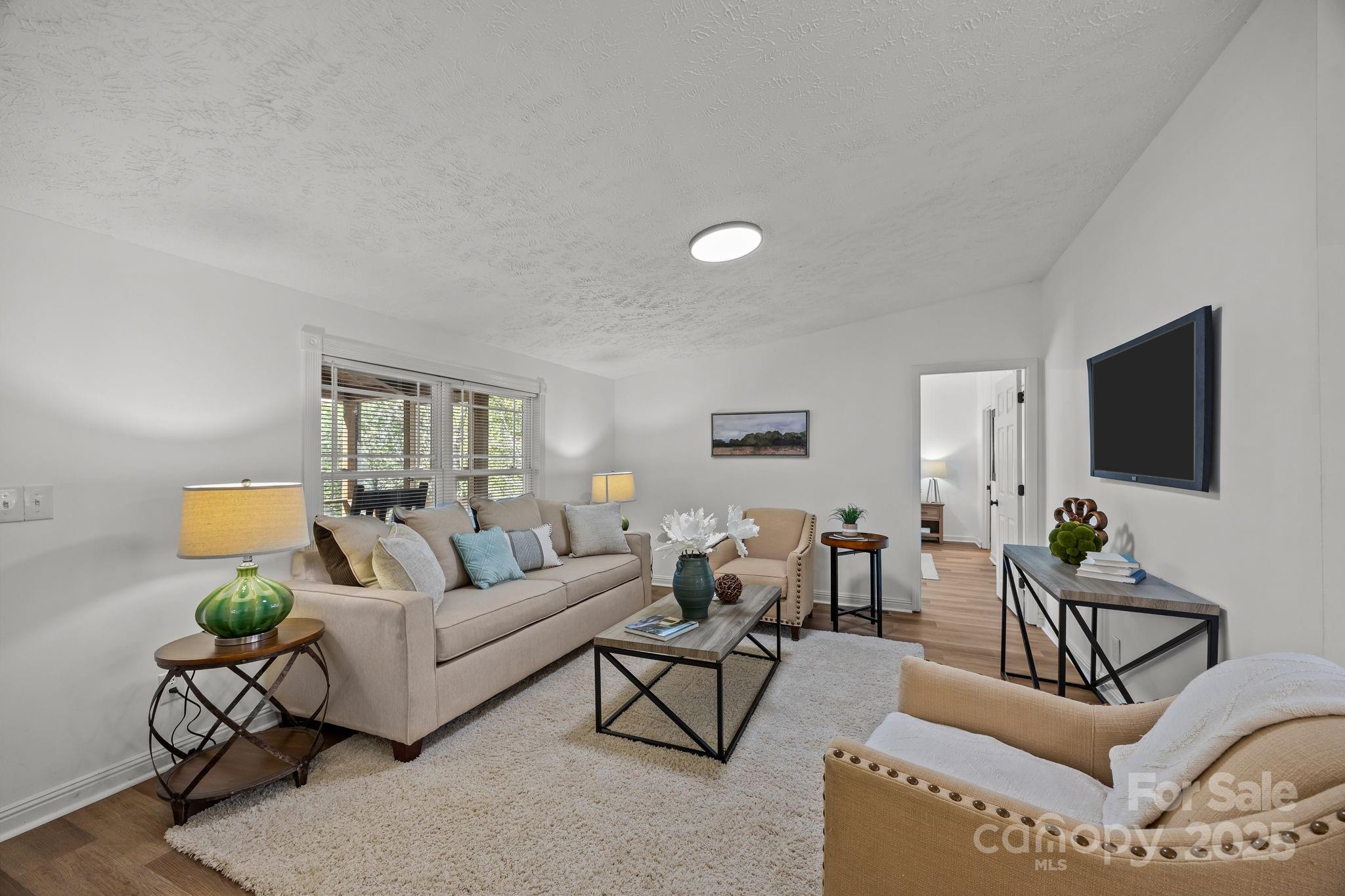 86 Tuts Terrace Sylva, NC 28779 - Photo 9 of 48 a living room with furniture and wooden floor