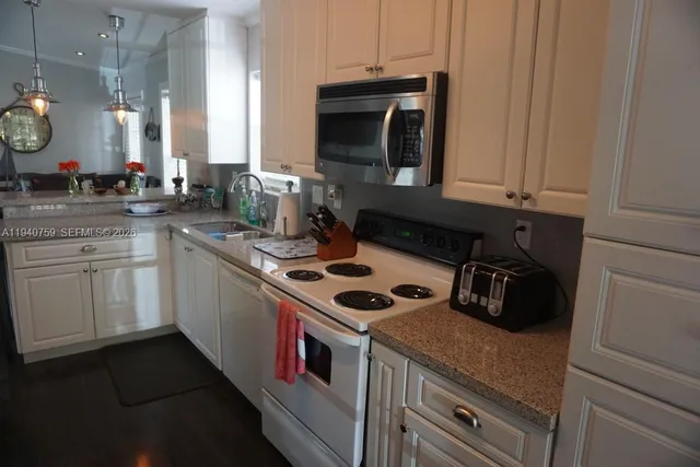 a bathroom with a sink vanity and a mirror