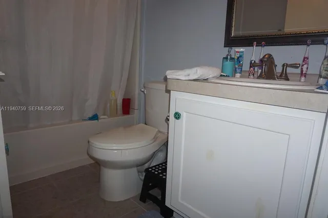 a kitchen with cabinets appliances a sink and a window