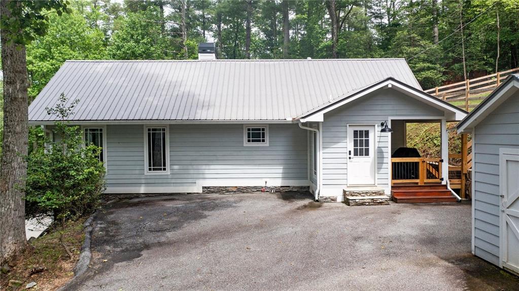 221 Reece Creek Road West Blairsville, GA 30512 - Photo 38 of 42 a view of a house with a garage and yard
